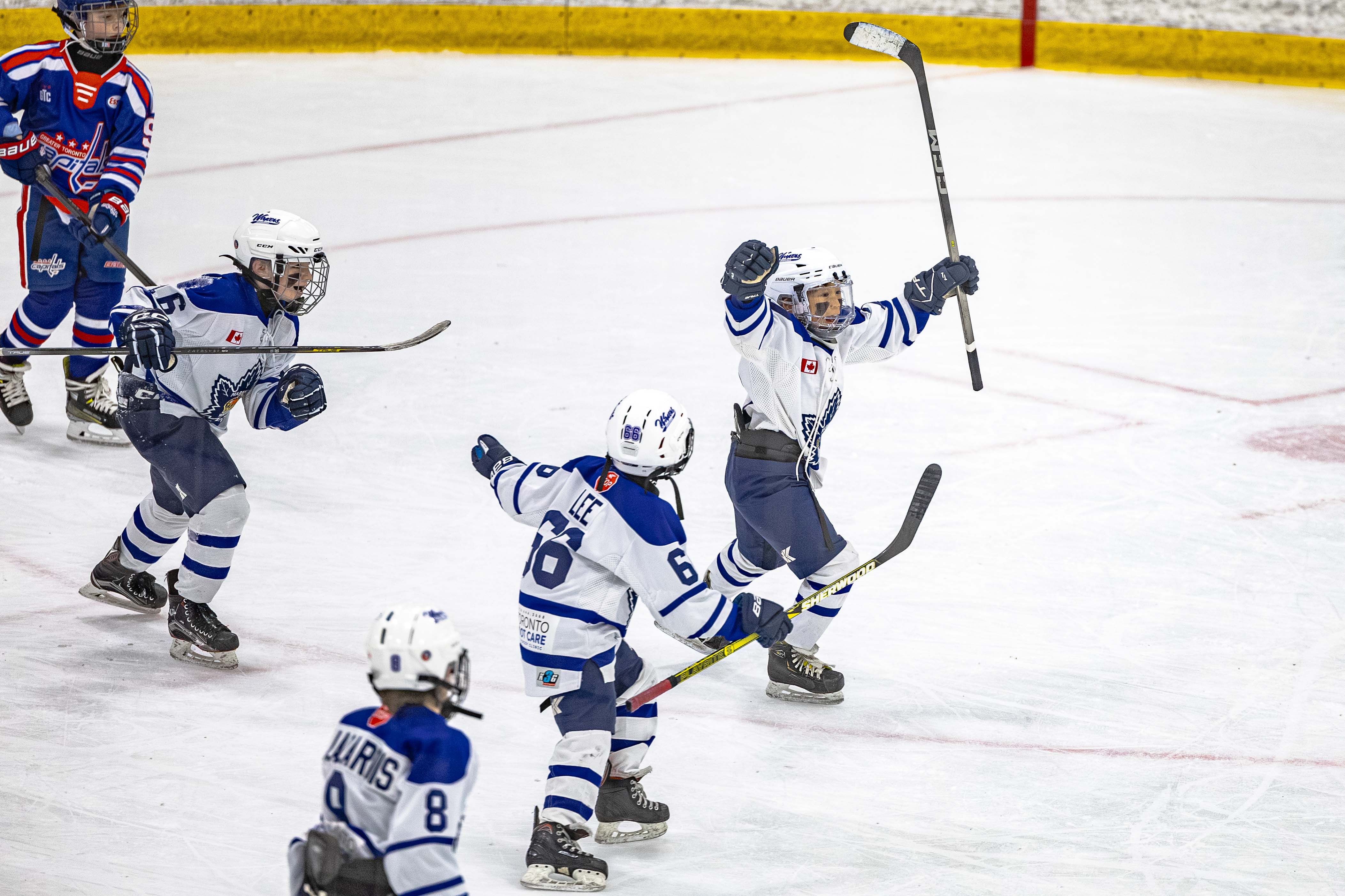 Markham Waxers U11 AA players celebrating on the ice